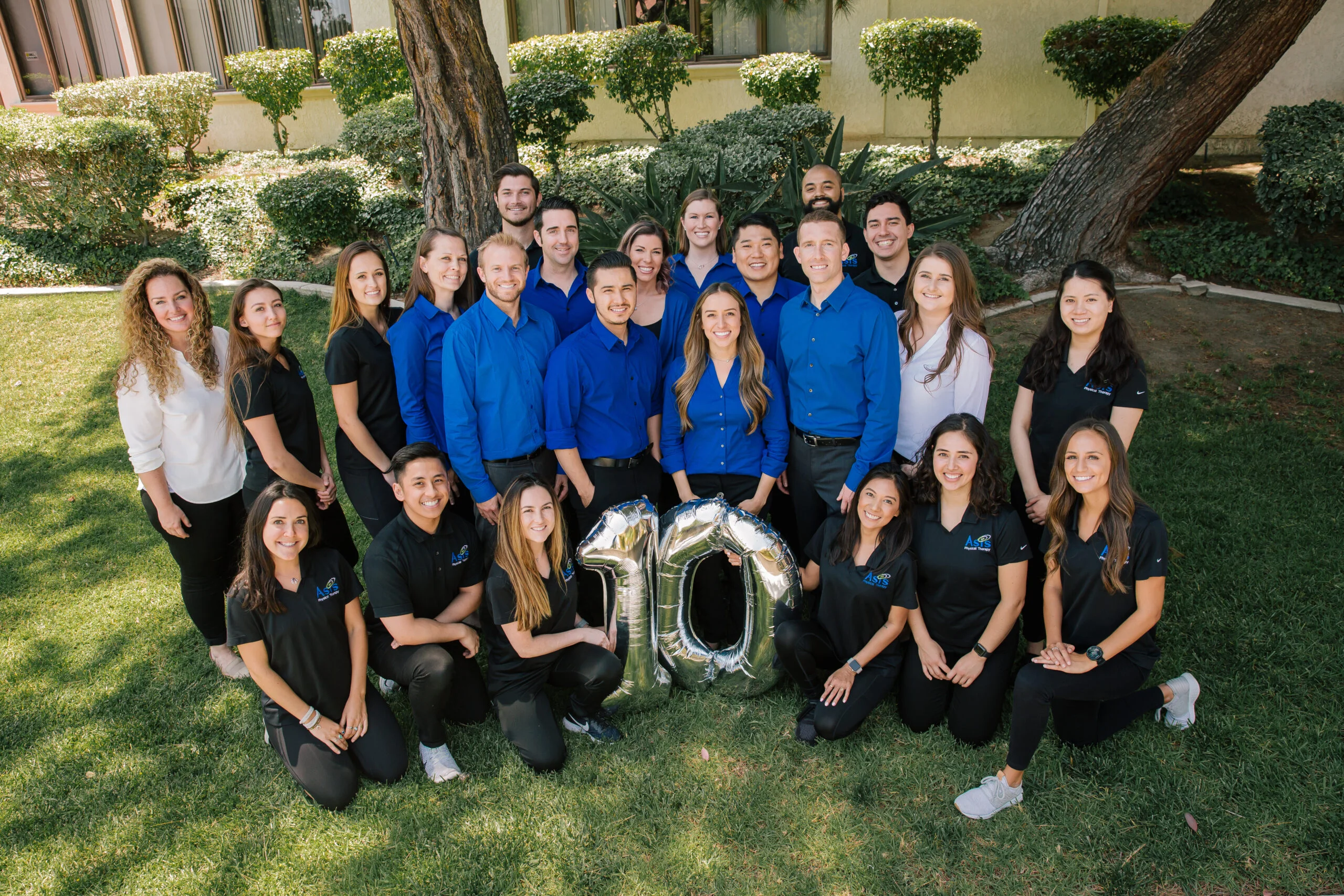 Doctor Vanessa Jackson, Kevin Pansky, David Chon, Leo King, Jake Fellow, Katie O’Connor, Haley Shetter, Sage Flynn, Bryant Ngo, Dave Karg, Brian Kaestner, Blake Williams, and the rest of the physical therapist posing for the 10th celebration - Asis Physical Therapy Doctor Vanessa Jackson, Kevin Pansky, David Chon, Leo King, Jake Fellow, Katie O’Connor, Haley Shetter, Sage Flynn, Bryant Ngo, Dave Karg, Brian Kaestner, Blake Williams, and the rest of the physical therapist posing for the 10th celebration - Asis Physical Therapy